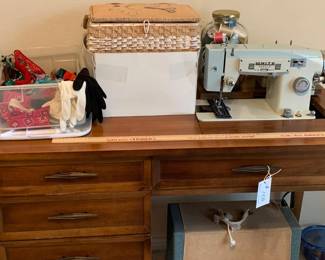 Working sewing machine with original case. Working sewing table and sewing accessories. Furniture.