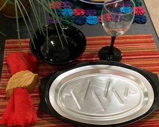 Sold as a set only: 4 steak plates, 4 black bowls, 4 goblets, 4 napkins, 4 napkin rings, and 4 placemats.