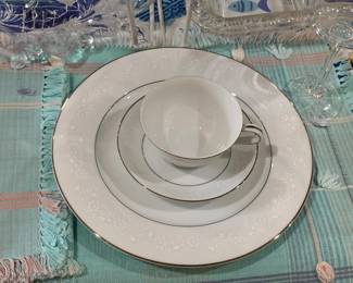 Sold as a Set only: Beautiful china with delicate pattern set of 8. Includes dinner, salad, butter plates, cups and saucers. 2 serving dishes. Platter. 8 placemats, 8 napkins, 8 goblets.