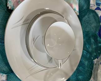 Sold as a Set Only: 8 dinner, salad, butter plates, 8 cups and saucers, 2 serving dishes, 1 platter, 8 napkins, 8 placemats, 8 goblets.