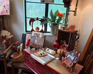 That is a beautiful red chest that those items are on…