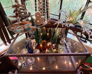 The apothecary display case from many many years ago. We love those handmade face brooches! Very clever.