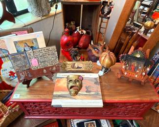 Nice vintage  retablo and don’t shy away from those two strange masks behind the red chest! Check them out…