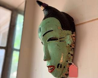 I think this is probably my favorite mask in the house. It’s the shade of green that I like so much and the elegant strangeness of it…