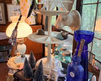 One of my favorite pieces is that strange rabbit hanging off the window and if you look in the corner on the right, there are some pretty neat photo plates that look good in a window. And don’t forget that cute dinosaur shaker!