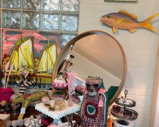 Yes… that is a real taxidermy fish on the wall. I love how it displays nicely with those scallop shells above it…