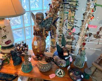 A detail of one of the shelving units here with all kinds of interesting items.… I think my faite things are those primitive figure pieces that are hanging on that tree..