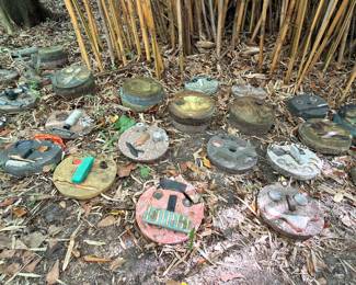 The artist created over 100 of these Clown faces that he displayed when the city took away his right away in front of his house. Interesting yard art for sure...