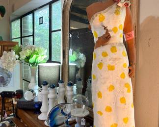 This crazy gal was part of a piece that the artist here had done, but that disintegrated. We do love this headless lady…