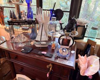 I had so much fun staging this sale! Lots of interesting items and display pieces. Those are two vintage model glove hands...