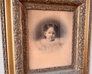 Antique frame with child’s  portrait 