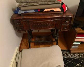 . . . early 1900's oak and wrought-iron sewing machine