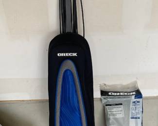 vintage, working vacuum cleaner with bags.