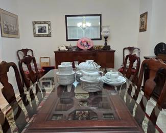 Asian inspired glass-topped dining table with 6 chairs