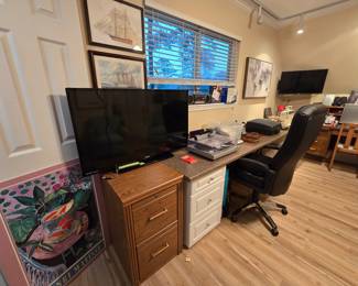 wooden file cabinet, TV, and nice desk chair