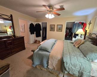 triple dresser with mirror matches headboard on bed