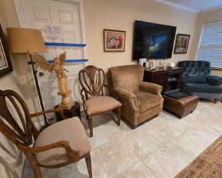 arm chairs with beautiful inlaid wood design, 2 plush chairs, floor lamp, TV & entertainment center
