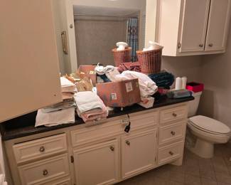 we are a work in progress :-) Lots of towels, linens, bedsheets and more! I promise this will be organized by opening day!