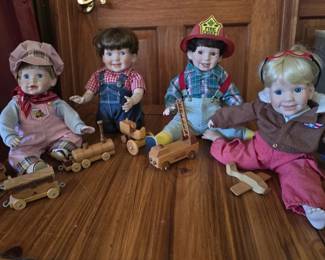 Set of Four Little Boy Dolls with Wooden Toys