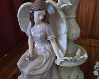 Seated Porcelain Lady with Angelic Motif