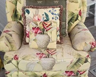 Bright upholstered club chair and pillows