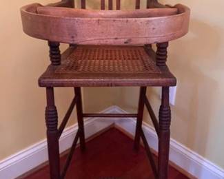 Vintage high chair with cane seat