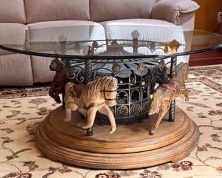 Revolving glass top carousel coffee table