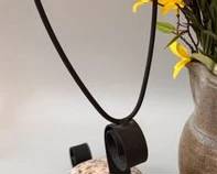 Stone and metal snail sculpture