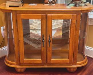 Curio cabinet with mirrored back and glass shelves