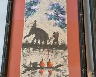 Decorative wall art depicting Southeast Asian scenes on handmade paper