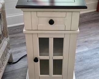 Side table cabinet with outlets on back