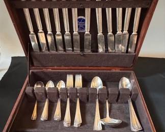 Rogers Bros. silverplate flatware in a Maken wooden silverware chest