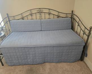Daybed with trundle that slides under the bed.
