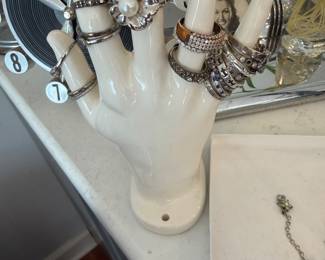 White Ceramic Hand Display Stand with Assorted Costume Rings