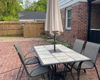 $262.00 - Patio Table and Chairs - Includes Umbrella