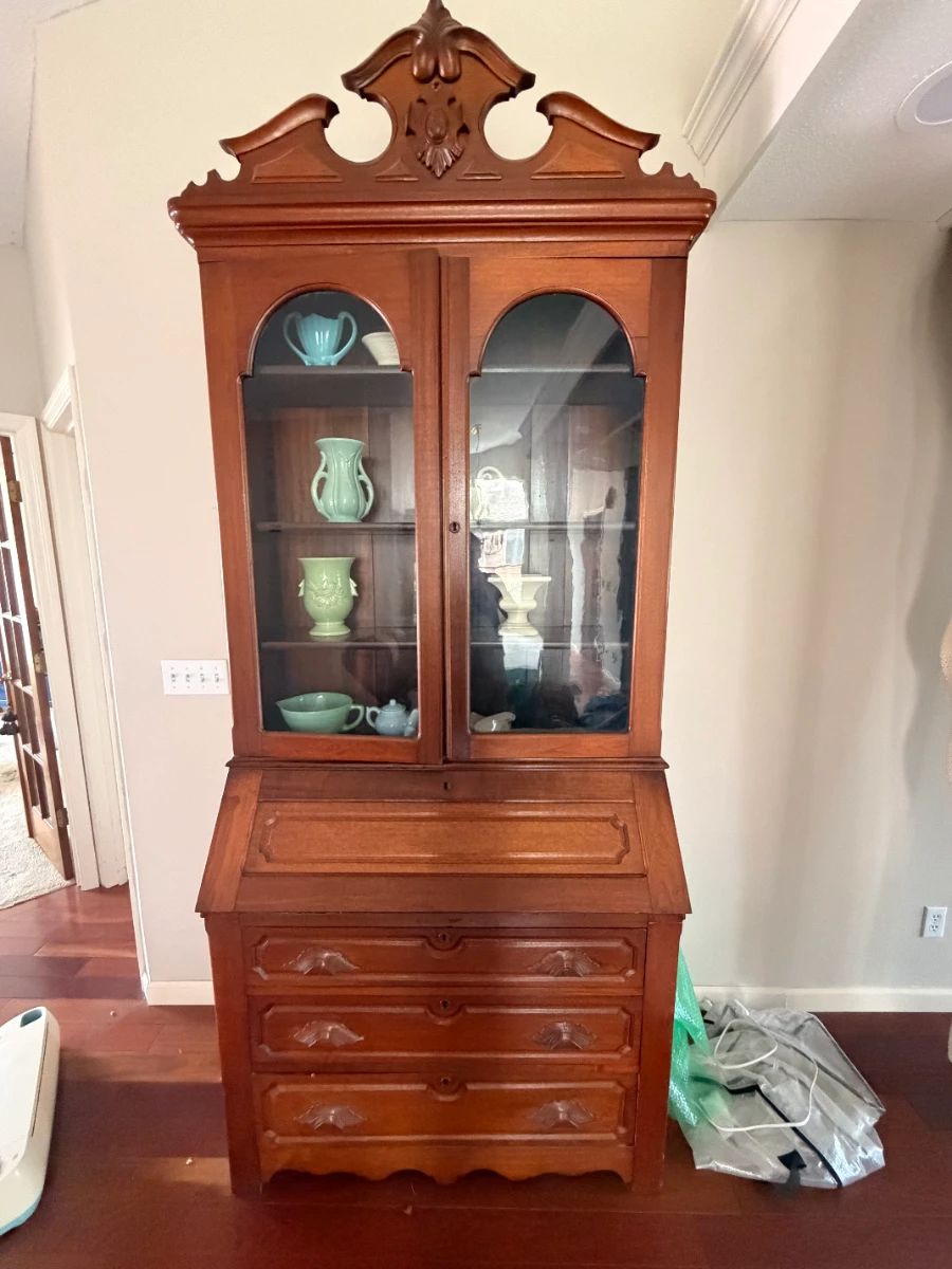 Stunning Vintage Secretary Desk/Hutch: A beautiful solid wood piece with an ornate broken-pedal pediment, arched glass doors, a slant-top desk, and spacious lower drawers.