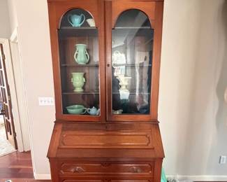 Stunning Vintage Secretary Desk/Hutch: A beautiful solid wood piece with an ornate broken-pedal pediment, arched glass doors, a slant-top desk, and spacious lower drawers.