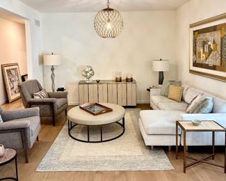 Michell Gold + Bob Williams White Sectional Sofa with Chaise Lounge, Michell Gold + Bob Williams Leather Ottoman, Sam Moore MCM Style Chairs, Michell Gold + Bob Williams Gold Buffet, Area Rug, Lamps and Décor 
