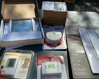 Lot 58: NEW In Box Smoke Alarms, Thermostats, Under Cabinet Lighting, Etc