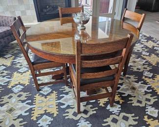 Stickley Dining Table and 6 chairs (2 chairs not shown).  Glass protective tabletop.