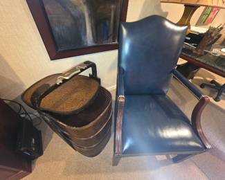 One of two leather side chairs