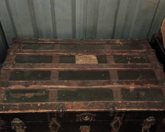 Lot 74: Antique black and wood steamer trunk 