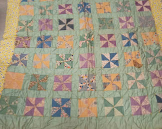 Lot 57: Antique handmade pinwheel design patchwork quilt 