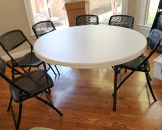 2 five foot round plastic outdoor tables w folding legs
