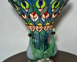 Three Peacocks And Their Feathers