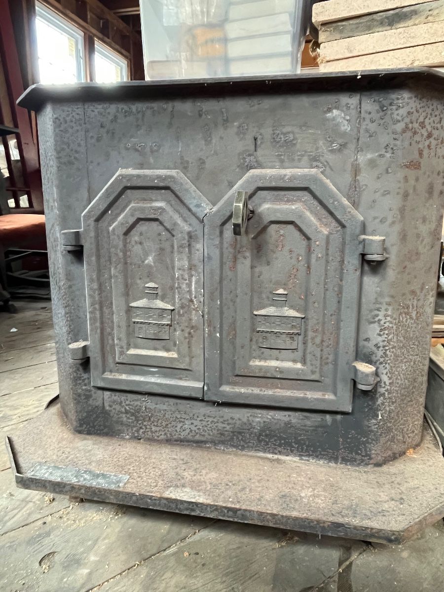 Garrison Stove Works wood stove with double doors and mesh screen