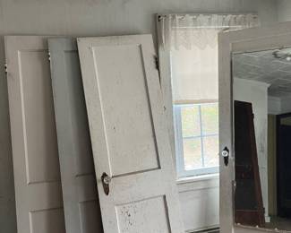 Solid wooden doors with glass knobs