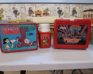 Vintage lunch boxes (have their thermos inside)