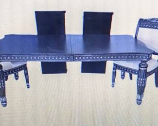 Black and silver, high end, solid wood table with leaves, scratch covers and 6 chairs, carved front, sides and back)
