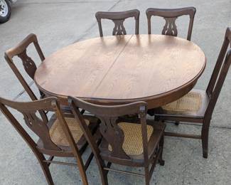 Antique oak table with 6 chairs, $350
